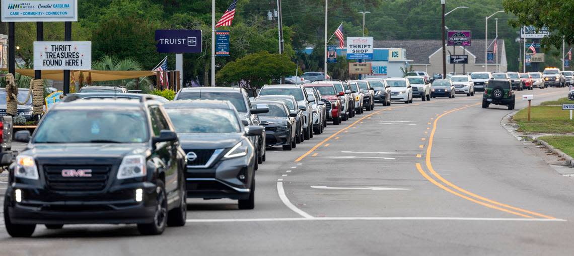 Traffic backs up on Beach Dr. to make the right turn on to River Road on Thursday, June 27, 2024 as visitors flock to the seafood restaurants in Calabash, N.C.