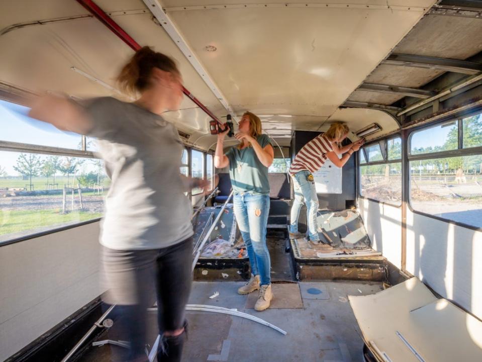 the three women renovating the interior of the bus