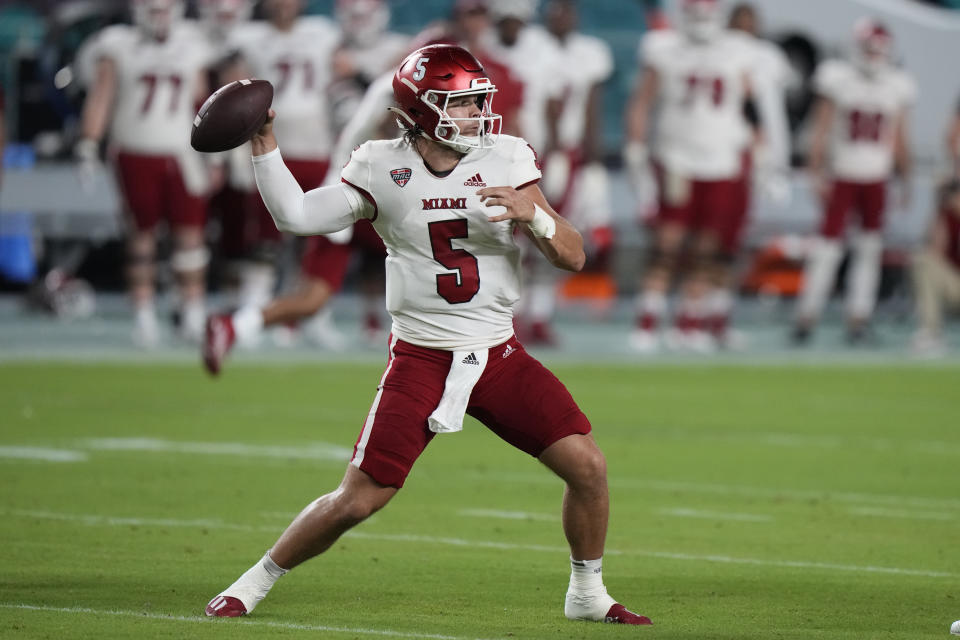 Miami (Ohio) quarterback Brett Gabbert throws a pass during the first half of an NCAA college football game against Miami, Friday, Sept. 1, 2023, in Miami Gardens, Fla. (AP Photo/Wilfredo Lee)