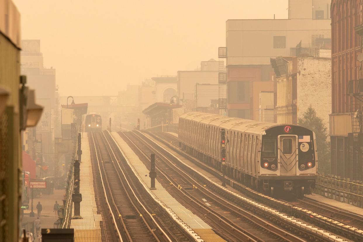 Smoke as a result from Canadian wildfires engulfs the New York area, making it the worst air quality in the world at the moment, as seen on a subway platform in Brooklyn (EPA)