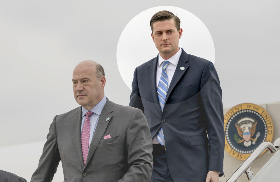 White House chief economic adviser Gary Cohn, left, and White House staff secretary Rob Porter, right, arrive at Andrews Air Force Base, Md., Thursday, Feb. 1, 2018, for a short trip to the White House after accompanying President Trump at the 2018 House and Senate Republican Member Conference at the Greenbrier resort in White Sulphur Springs, W.Va. (AP Photo)