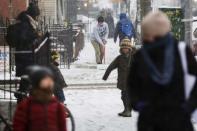 A man shovels snow off of the sidewalk during a snow storm in New York March 3, 2015. REUTERS/Lucas Jackson