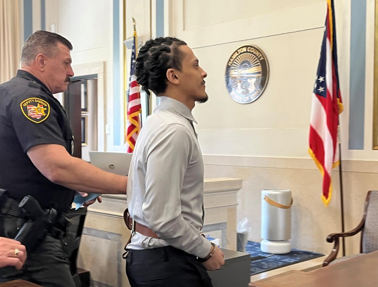 Nolan Garrett is escorted out of the courtroom after being sentenced to 24 years to life in prison on Monday.