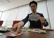 Kang Dong Wan, 48, a professor at South Korea's Dong-A University, speaks with trash from North Korea during an interview in Seoul, South Korea on April 4, 2022. Kang has turned to a different way of collecting information about secretive North Korea as pandemic restrictions make it harder for outsiders to find out what's life like for North Koreans. (AP Photo/Ahn Young-joon)