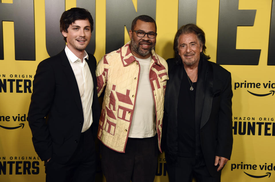 Jordan Peele, center, executive producer of the Amazon Prime Video series "Hunters," poses with cast members Logan Lerman, left, and Al Pacino at the premiere of the show at the Directors Guild of America, Wednesday, Feb. 19, 2020, in Los Angeles. (AP Photo/Chris Pizzello)
