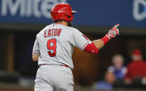 Los Angeles Angels' Adam Eaton (9) celebrates after hitting a solo home run in the third inning of a baseball game against the Texas Rangers, Thursday, Aug. 5, 2021, in Arlington, Texas. (AP Photo/Brandon Wade)