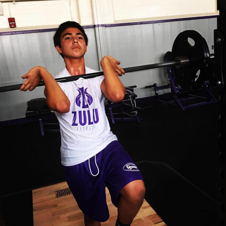 Carlos Reales Dominguez, charged with two murders and an attempted murder in the Davis stabbings case, lifts weights in a photo posted on the Castlemont High School football program’s Instagram account in 2017.