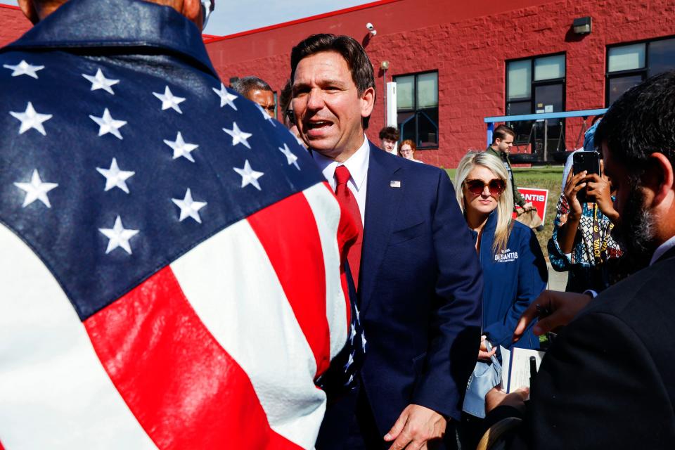 Republican presidential candidate and Florida Gov. Ron DeSantis greets a supporter at a town hall at Refuge City Church, in northeast Cedar Rapids, Iowa, Sunday, Oct. 8, 2023. (Jim Slosiarek/The Gazette via AP)