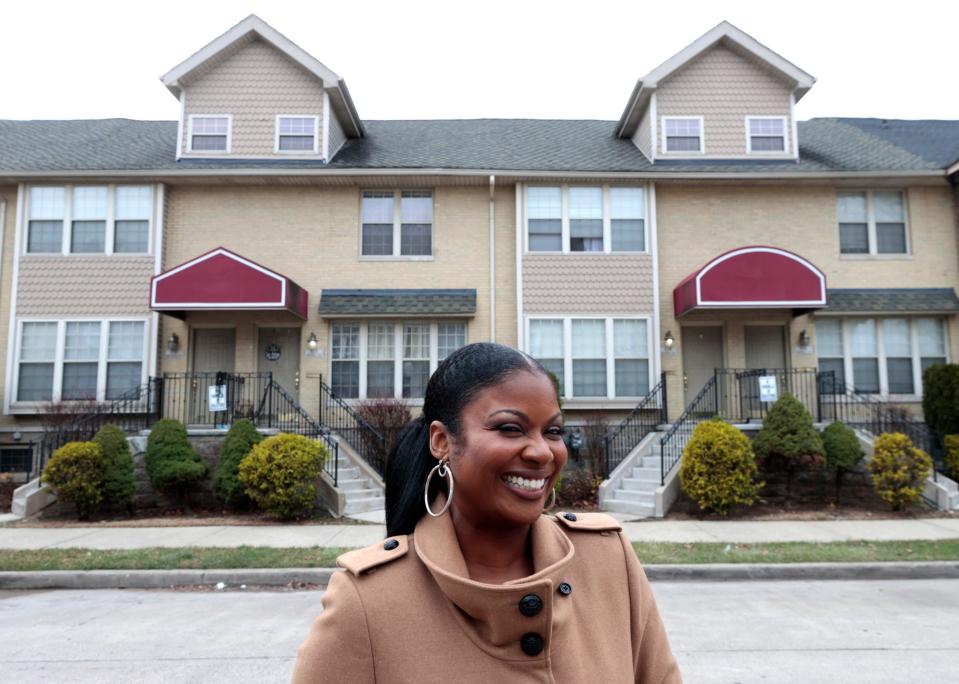 Sauda Ahmad-Green from S&S Development Group in front of Merrill Place I on Friday, December 8, 2023. These townhomes which are her first development project will soon be joined by Merrill Place II as ground was broken for the new townhomes back in October.