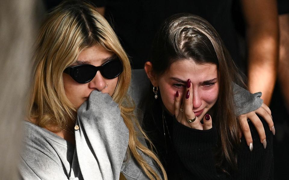 Mourners react during the funeral of Israeli soldier Sergeant Daniel Oz, who was killed at the Gaza border, amid the ongoing ground operation of the Israeli army against Hamas, at the military cemetery in Kfar Saba, Israel, February 26, 2024.