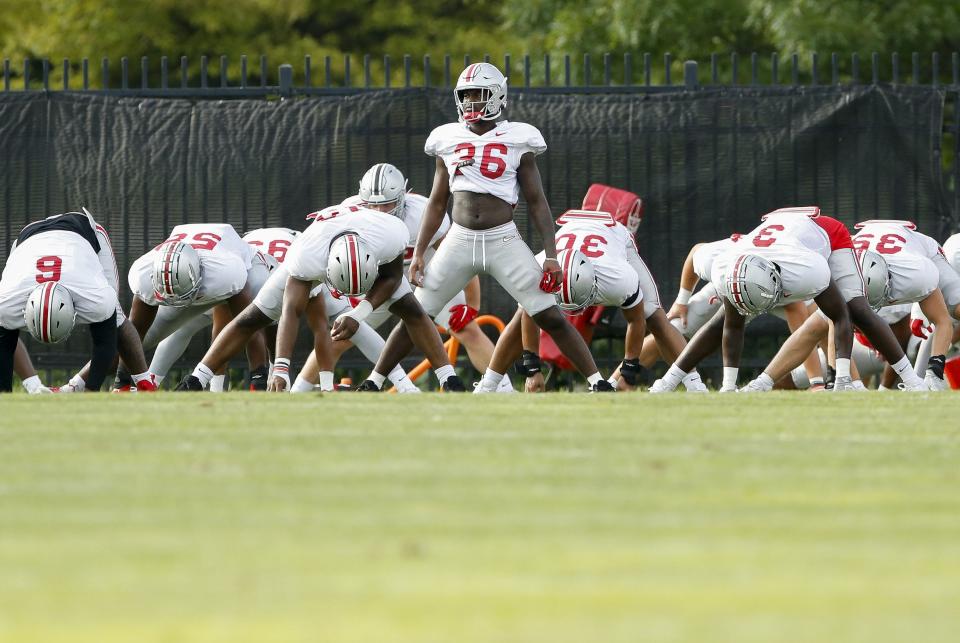 Ohio State Buckeyes linebacker K'Vaughan Pope (36) stretches during football training camp at the Woody Hayes Athletic Center in Columbus on Tuesday, Aug. 10, 2021. 