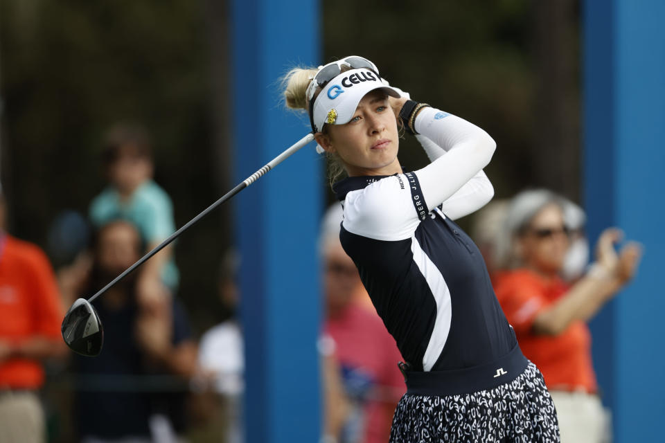 Nelly Korda watches her tee shot on the first hole during the second round of the PNC Championship golf tournament Sunday, Dec. 19, 2021, in Orlando, Fla. (AP Photo/Scott Audette)