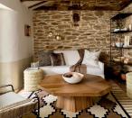 <p> Exposed brick, wooden beams, layered up rugs, and swishy throw cushions &#x2013; this modern rustic living room is so cozy and inviting and yet still really contemporary in feeling. </p> <p> This kind of modern cabin look is bang on trend right now and is super simple to master, just pick a neutral color palette &#x2013; browns, creams, maybe throw in some muted terracotta &#x2013; and plenty of different textures like wool, fur and rattan. Easy! Who needs a stylish chalet in the mountains when you can create the look in your own living room? </p>