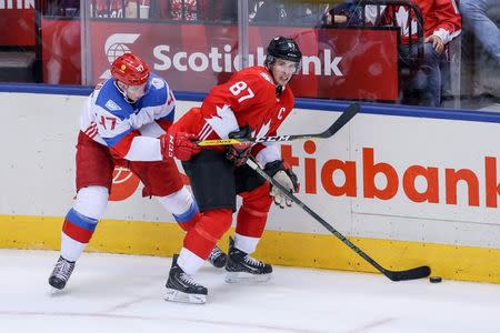 Sep 24, 2016; Toronto, Ontario, Canada; Team Canada centre Sidney Crosby (87) skates with the puck against Team Russia defenceman Alexey Marchenko (47) in the third period during a semifinal game in the 2016 World Cup of Hockey at Air Canada Centre. Mandatory Credit: Kevin Sousa-USA TODAY Sports