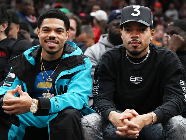 <p>Quinn Harris/Getty</p> Chance the Rapper and brother Taylor Bennett during the game between the Chicago Bulls and the Phoenix Suns at United Center on March 03, 2023 in Chicago, Illinois.