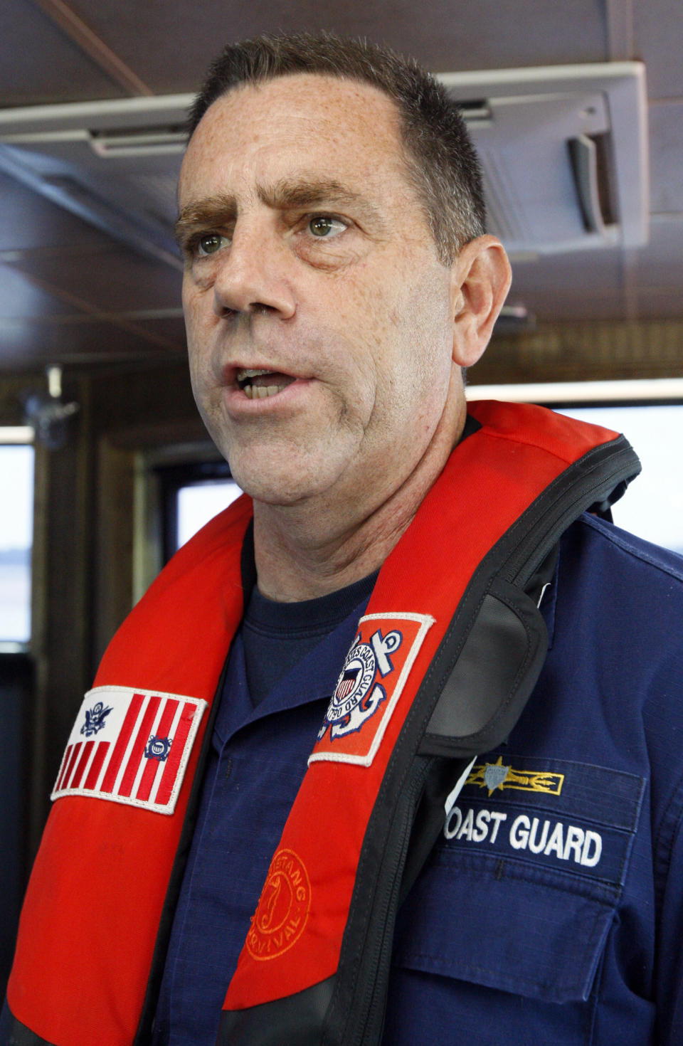 Coast Guard Capt. William Drelling explains their duties as to the current situation on the Mississippi River, Wednesday, Aug. 22, 2012 near Greenville, Miss. (AP Photo/Rogelio V. Solis)