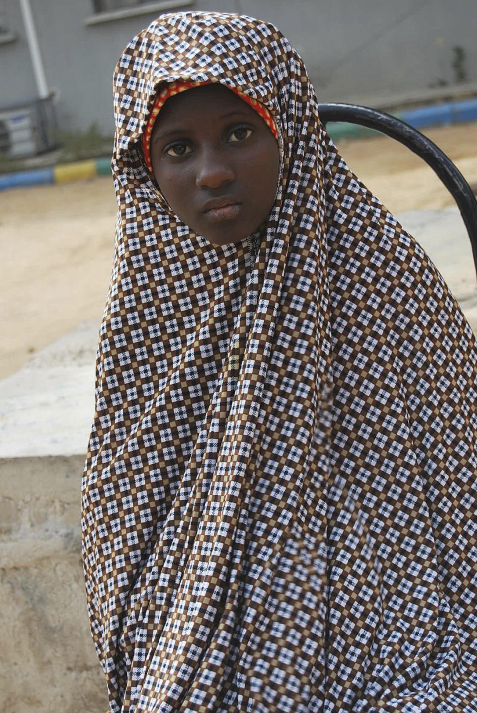 FILE - This Dec. 24, 2014 file photo, shows Zahra'u Babangida, a 13 year-old girl arrested with explosives strapped to her body in Kano Nigeria. Radical Islamic militants from Boko Haram are increasingly forcing children to carry out bombings, with the number of attacks since January already nearly reaching the total for all of last year, according to a report released Wednesday, April 12, 2017 by the U.N. children's agency. (AP Photo/File)