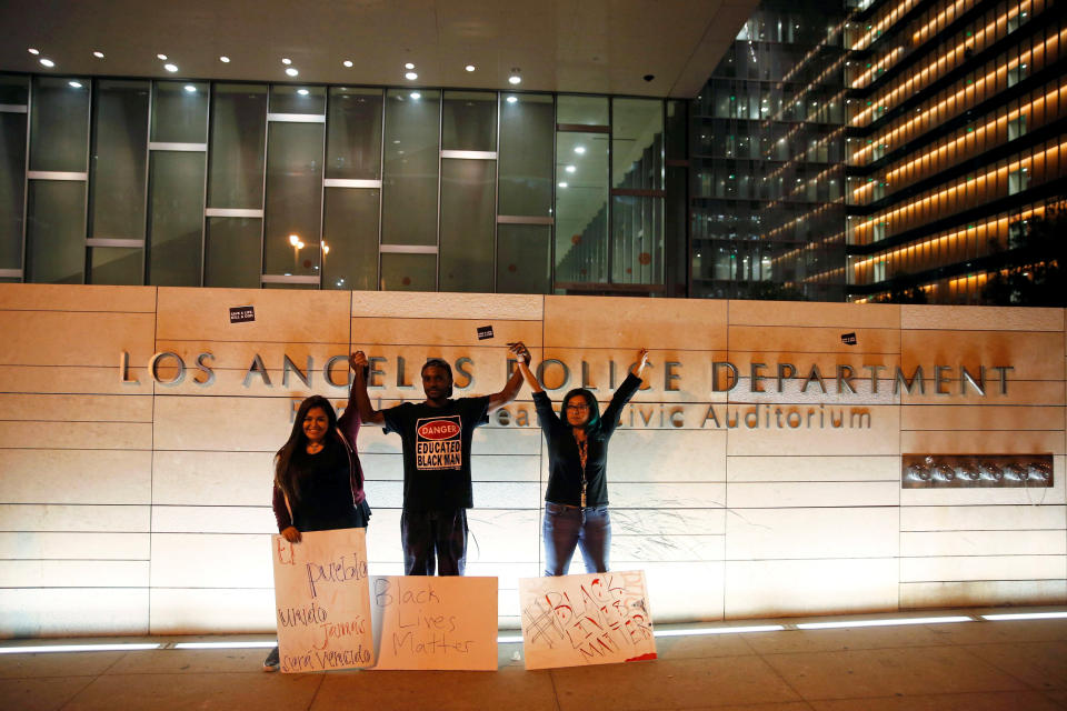 Black Lives Matter activists stand&nbsp;together after a protest outside the Los Angeles Police Department headquarters.