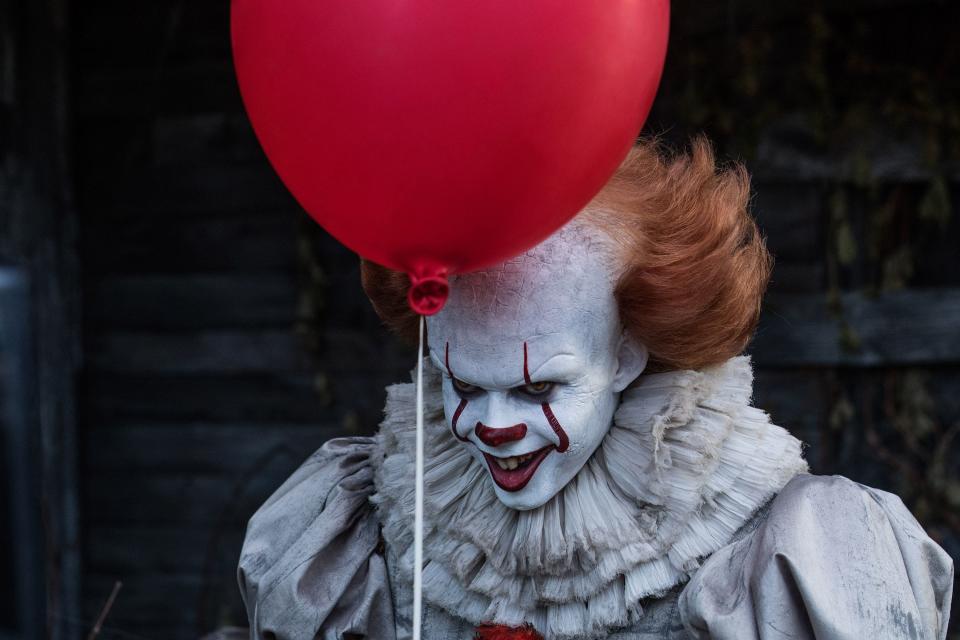 The evil clown Pennywise (Bill Skarsgård) threatens the kids of Derry in "It."