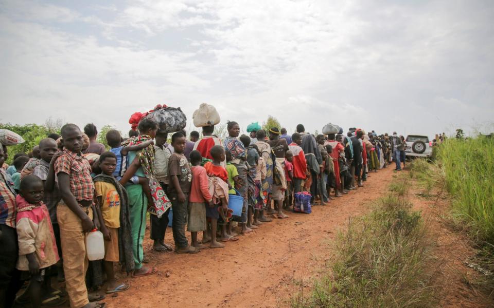 Congolese asylum-seekers line up to undergo security and health screening in Zombo, near the border between Uganda and the Democratic Republic of Congo. - Rocco Nuri /UNHCR