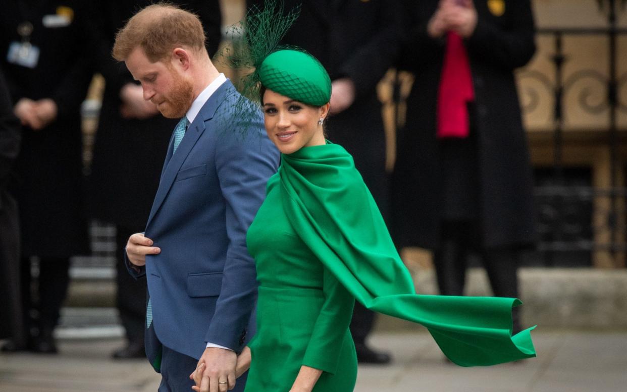 The Duke and Duchess of Sussex, wearing Emilia Wickstead, at their final public appearence as senior working royals in March - Getty