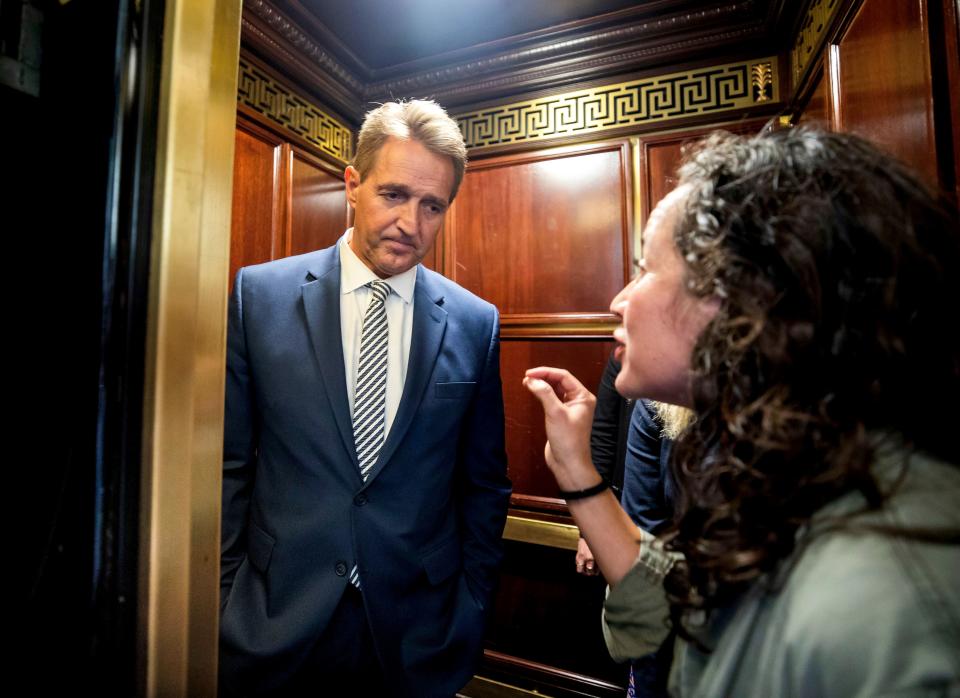 A woman who said she is a survivor of a sexual assault confronts Sen. Jeff Flake, R-Ariz., in an elevator in the Russell Senate Office Building in Washington on Sept. 28, 2018. (Photo: Jim Lo Scalzo/EPA-EFE/REX/Shutterstock)