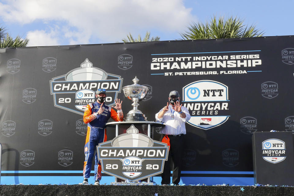 Scott Dixon, left, and Chip Ganassi celebrate after winning the NTT IndyCar Series Championship following an IndyCar auto race Sunday, Oct. 25, 2020, in St. Petersburg, Fla. (AP Photo/Mike Carlson)