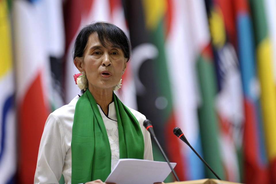 Myanmar opposition leader Aung San Suu Kyi speaks at a news conference during the annual meeting of the International Labour Organization (ILO) in Geneva, Switzerland, Thursday, June 14, 2012. Suu Kyi said that investment in her country should strengthen its nascent process of democratization. The Nobel peace laureate spoke Thursday to the annual meeting of the ILO in Geneva on the first stop of her trip to Europe. (AP Photo/Keystone, Martial Trezzini)