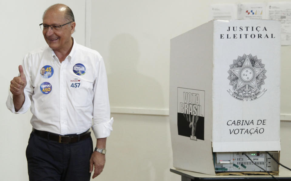 Brazil&#39;s presidential candidate for the Brazilian Social Democratic Party (PSDB), Geraldo Alckmin gives his thumb up after voting during general elections, in Sao Paulo, Brazil, on October 7, 2018. - Brazilians began casting ballots Sunday in their most divisive presidential election in years, with a far-right politician promising an iron-fisted crackdown on crime, Jair Bolsonaro, the firm favorite in the first round. (Photo by Miguel SCHINCARIOL / AFP) / The erroneous mention appearing in the metadata of this photos BRAZIL-ELECTION-ALCKMIN has been modified in AFP systems in the following manner: [BYLINE: Miguel Schinchariol] instead of [Alexandre Schneider]. Please immediately remove the erroneous mention[s] from all your online services and delete it (them) from your servers. If you have been authorized by AFP to distribute it (them) to third parties, please ensure that the same actions are carried out by them. Failure to promptly comply with these instructions will entail liability on your part for any continued or post notification usage. Therefore we thank you very much for all your attention and prompt action. We are sorry for the inconvenience this notification may cause and remain at your disposal for any further information you may require.        (Photo credit should read MIGUEL SCHINCARIOL/AFP via Getty Images)