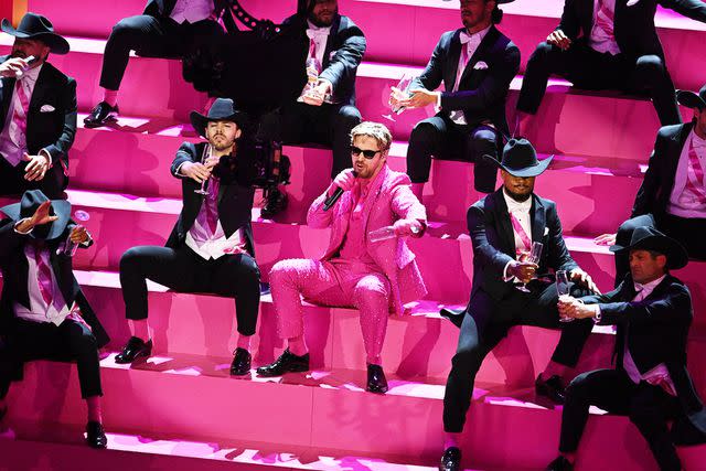 <p>PATRICK T. FALLON/AFP via Getty</p> Ryan Gosling performing 'I'm Just Ken' from 'Barbie' at the Oscars on March 10, 2024