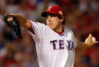 Derek Holland delivers a pitch in the first inning of Game 4 of the World Series