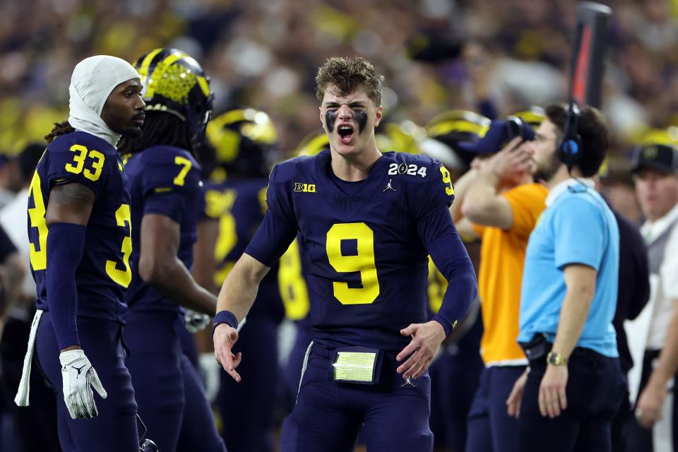HOUSTON, TEXAS - JANUARY 08: J.J. McCarthy #9 of the Michigan Wolverines reacts in the second half against the Washington Huskies during the 2024 CFP National Championship game at NRG Stadium on January 08, 2024 in Houston, Texas. (Photo by Gregory Shamus/Getty Images)