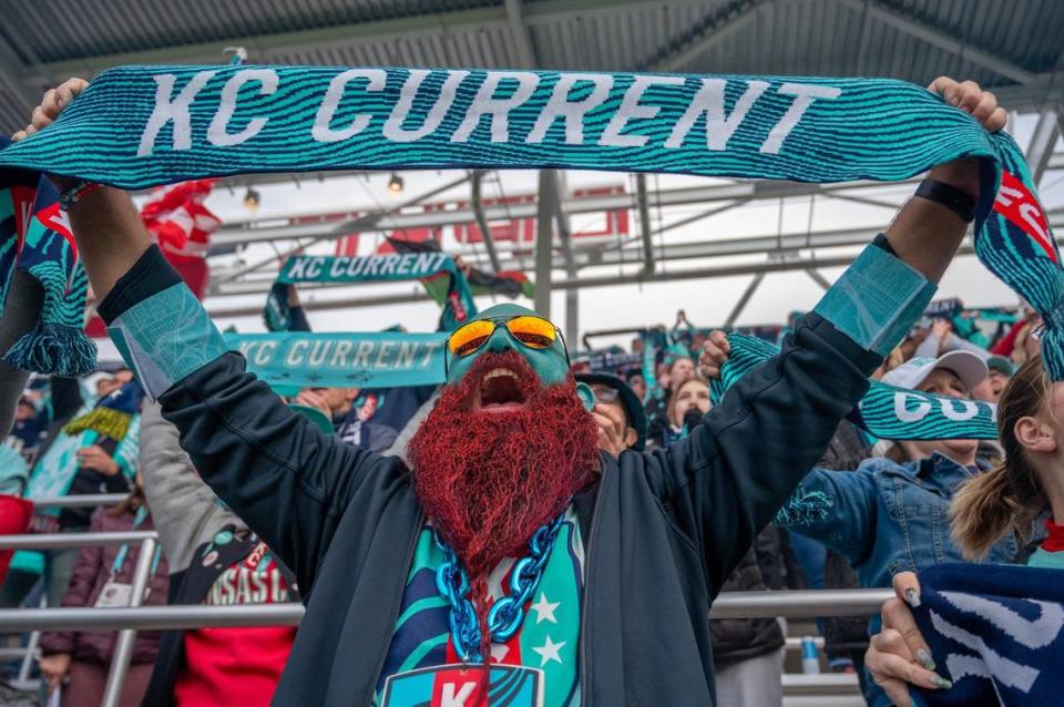 Richard Harper, draped in Kansas City Current colors, with his face and beard painted to match, passionately cheers during Saturday’s game Bay FC on Saturday, April 20, 2024, in Kansas City.