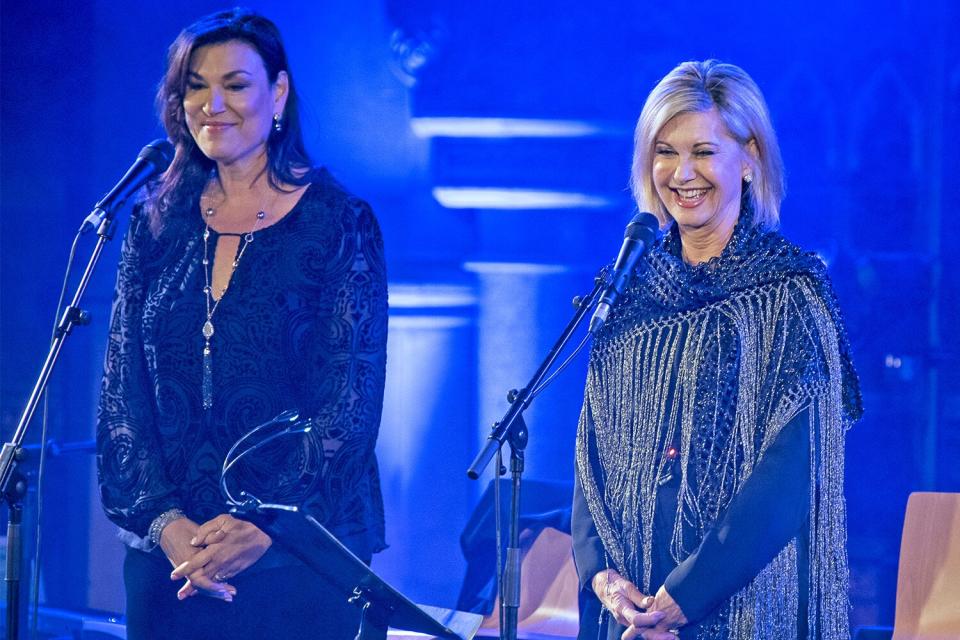 LONDON, ENGLAND - JANUARY 26: Amy Sky (L) and Olivia Newton-John perform at the Union Chapel on January 26, 2017 in London, England. (Photo by Imelda Michalczyk/Redferns)
