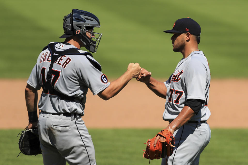 Detroit Tigers' Grayson Greiner (17) celebrates with Joe Jimenez (77) after defeating the Cincinnati Reds in a baseball game at Great American Ballpark in Cincinnati, Sunday, July 26, 2020. (AP Photo/Aaron Doster)