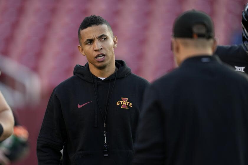 Iowa State offensive coordinator Nate Scheelhaase stands on the sideline before a game.