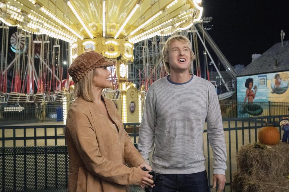 Jennifer Lopez and Owen Wilson at a carnival in Marry Me