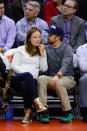 Look past the weird head petting PDA and you’ll see that courtside regulars Olive Wilde and Jason Sudeikis are both stylish and sporty. The actress’s gold high-top Nike sneakers give off both glam and athleticism.