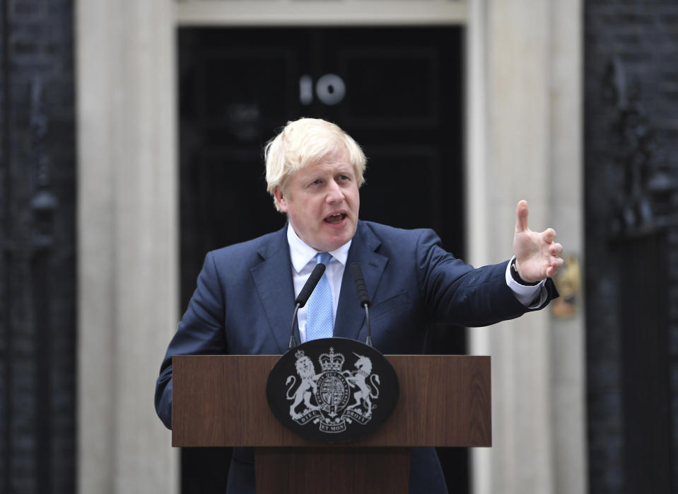 Britain's Prime Minister Boris Johnson speaks to the media outside 10 Downing Street in London, Monday, Sept. 2, 2019. Johnson says chances of a Brexit deal are rising (Victoria Jones/PA via AP)