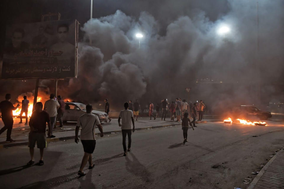 Protesters angry over the area’s crippling electricity shortages, set fire to tires on Thursday, Sept. 10, 2020 in Benghazi, Libya. Libya’s east-based parliament has convened an emergency meeting to address the eruption of rare protests over dire living conditions across the country’s east. Friday's session of the House of Representatives comes after hundreds of young Libyans flooded the streets of Benghazi and other eastern cities. (Hakeam el-Yamany via AP)