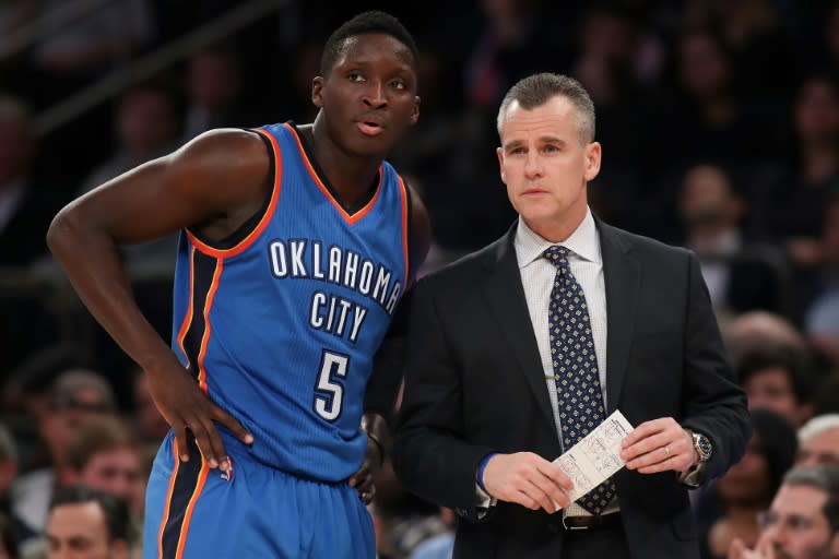 The Oklahoma City Thunder point guard Victor Oladipo and head coach Billy Donovan watch a NBA game at Madison Square Garden in New York