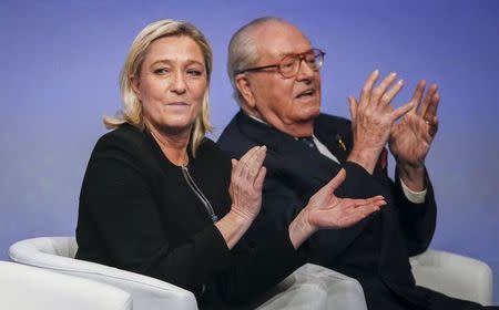 Marine Le Pen (L), France's National Front political party leader, and her father Jean-Marie Le Pen attend their party congress in Lyon in this November 29, 2014 file photo. REUTERS/Robert Pratta/Files