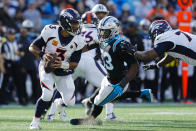Denver Broncos quarterback Russell Wilson plays during the first half of an NFL football game between the Carolina Panthers and the Denver Broncos on Sunday, Nov. 27, 2022, in Charlotte, N.C. (AP Photo/Rusty Jones)