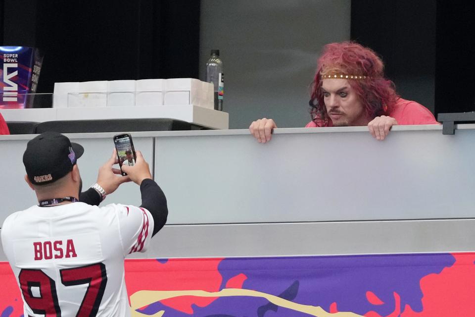 Stand-up comedian Carrot Top poses for a photo before Super Bowl LVIII between the San Francisco 49ers and the Kansas City Chiefs at Allegiant Stadium.