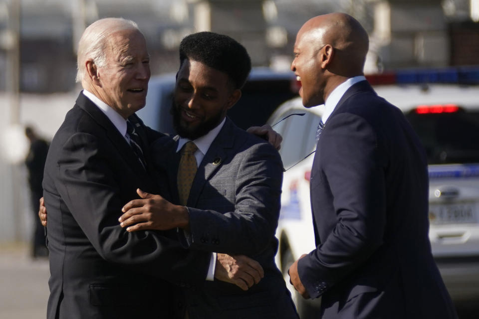 President Joe Biden greets Baltimore Mayor Brandon Scott, center, and Maryland Gov. Wes Moore as he arrives and before speaking about infrastructure at the Baltimore and Potomac Tunnel North Portal in Baltimore, Monday, Jan. 30, 2023. (AP Photo/Andrew Harnik)