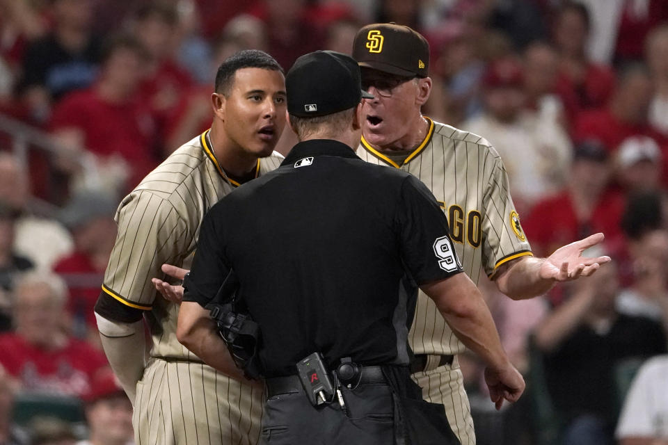 San Diego Padres' Manny Machado, left, and manager Bob Melvin, right, argue with home plate umpire Chris Segal during the sixth inning of a baseball game against the St. Louis Cardinals Tuesday, May 31, 2022, in St. Louis. Segal ejected both Machado and Melvin. (AP Photo/Jeff Roberson)
