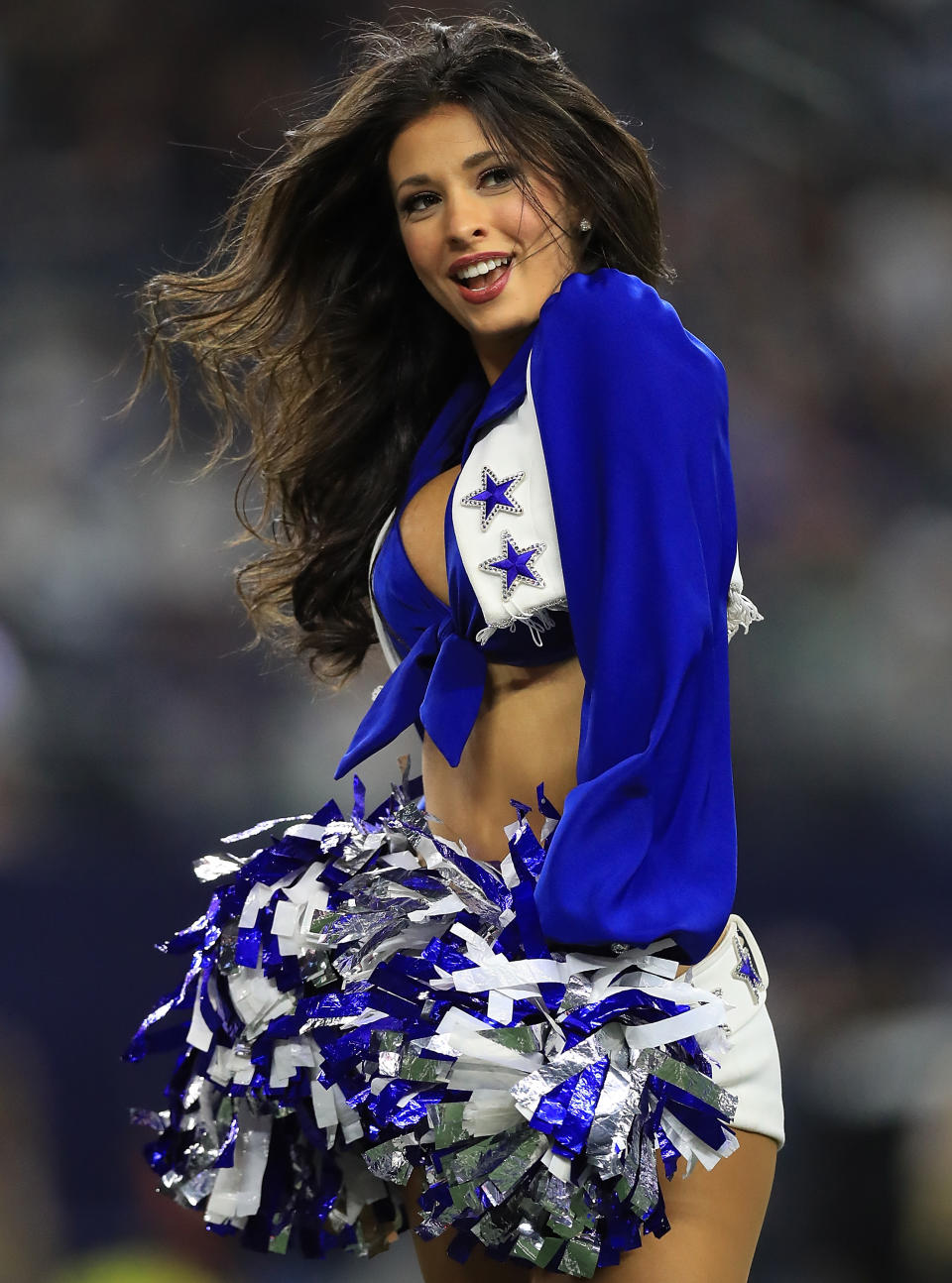 <p>A Dallas Cowboys Cheerleader performs at AT&T Stadium on November 19, 2017 in Arlington, Texas. (Photo by Ronald Martinez/Getty Images) </p>