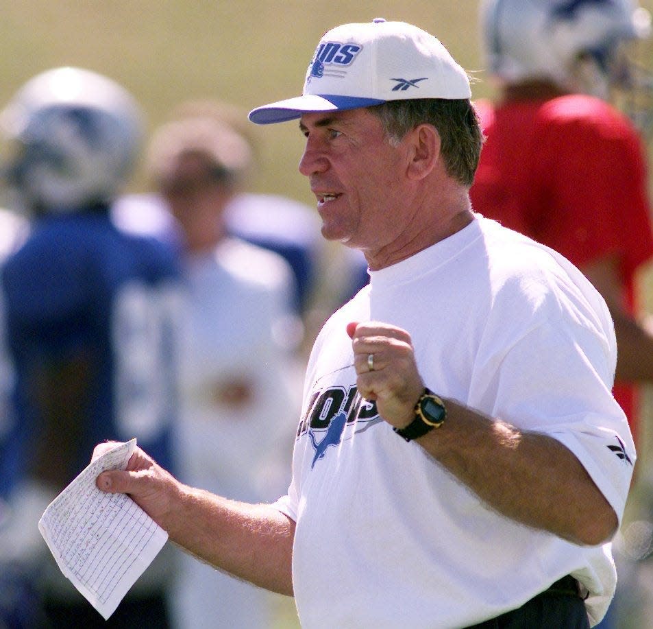 Lions linebacker coach Gary Moeller goes over technique with linebackers during training camp in 1998 at Saginaw Valley State.