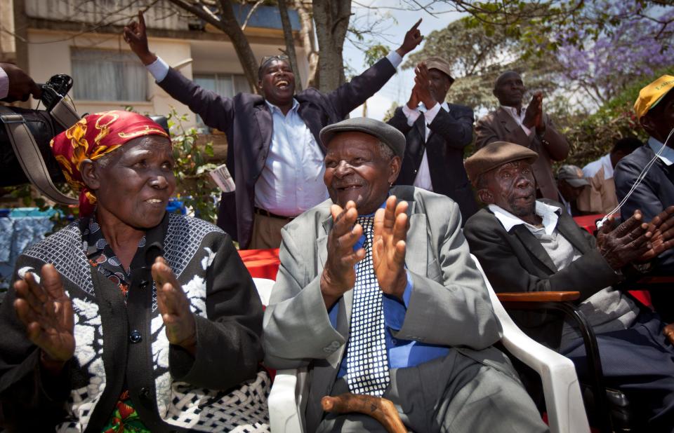 Kenyans celebrate the announcement of a legal decision in their case at Britain's High Court concerning Mau Mau veterans.