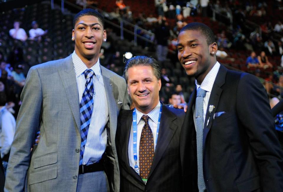 Kentucky head coach John Calipari, center, stands with former players Anthony Davis, left, and Michael Kidd-Gilchrist, right, before the NBA basketball draft, Thursday, June, 28, 2012, in Newark, N.J. Davis was selected the No. 1 overall pick by the New Orleans Hornets, and Kidd-Gilchrist was selected No. 2 by the Charlotte Bobcats. (AP Photo/Mel Evans)